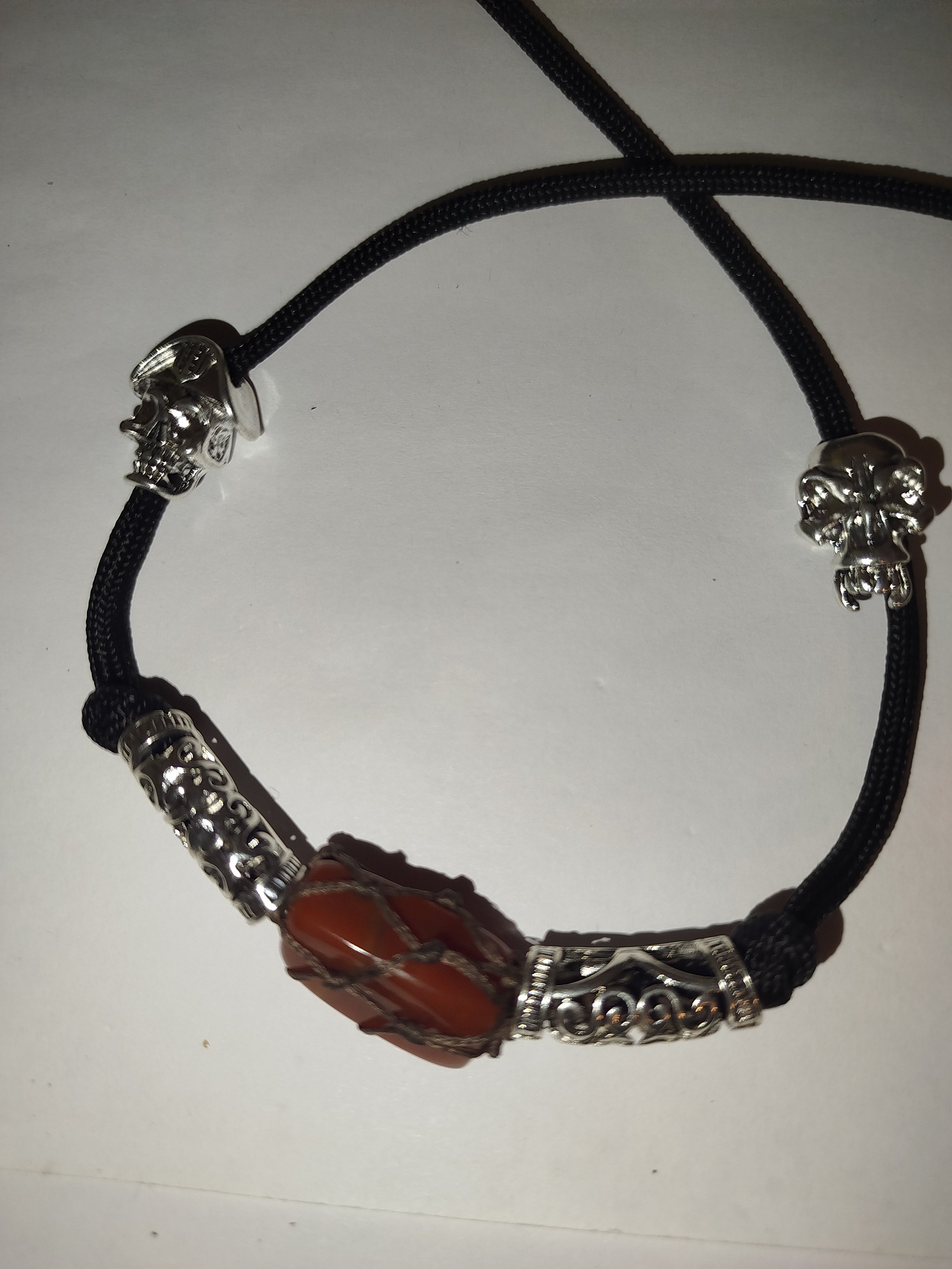 Paracord crystal necklace with metal beads.